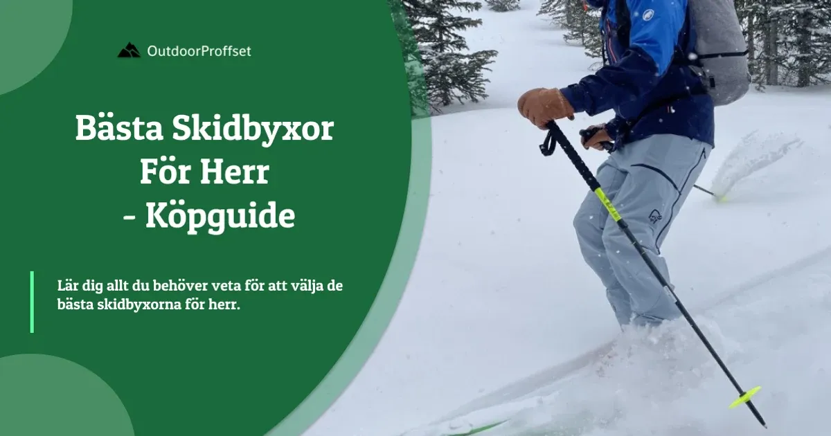 Man i blå jacka och grå skidbyxor med turstavar i snö